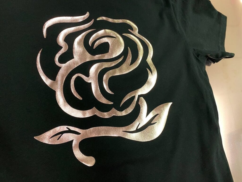 picture of balck shirt with rose design in the Siser 'Golden Rose' Metal heat transfer vinyl